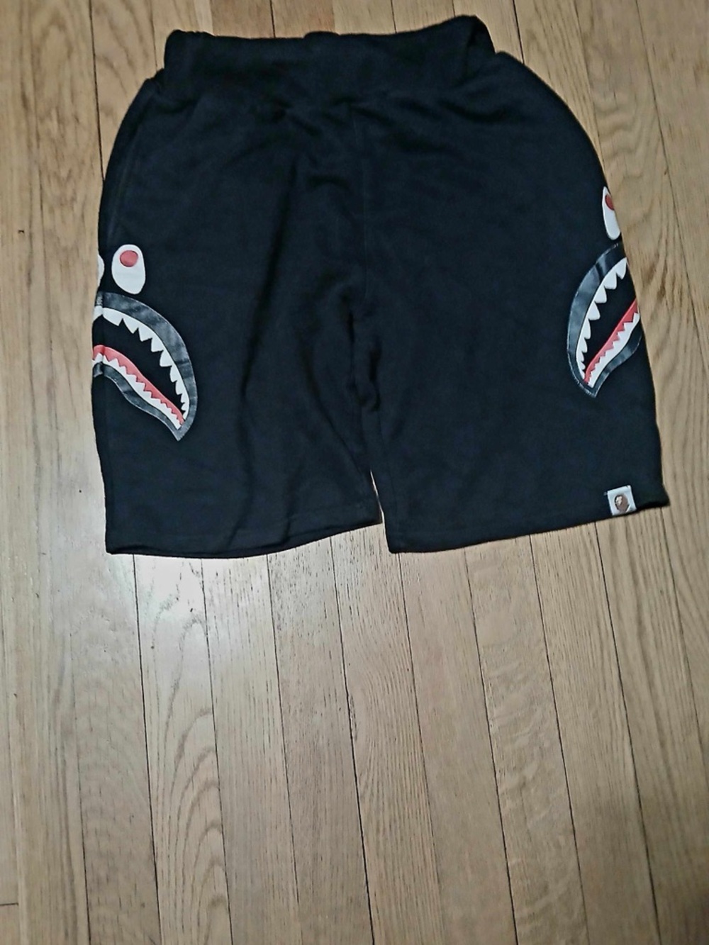 Bape Black Shark Face Graphic Athletic Shorts with Red Accents